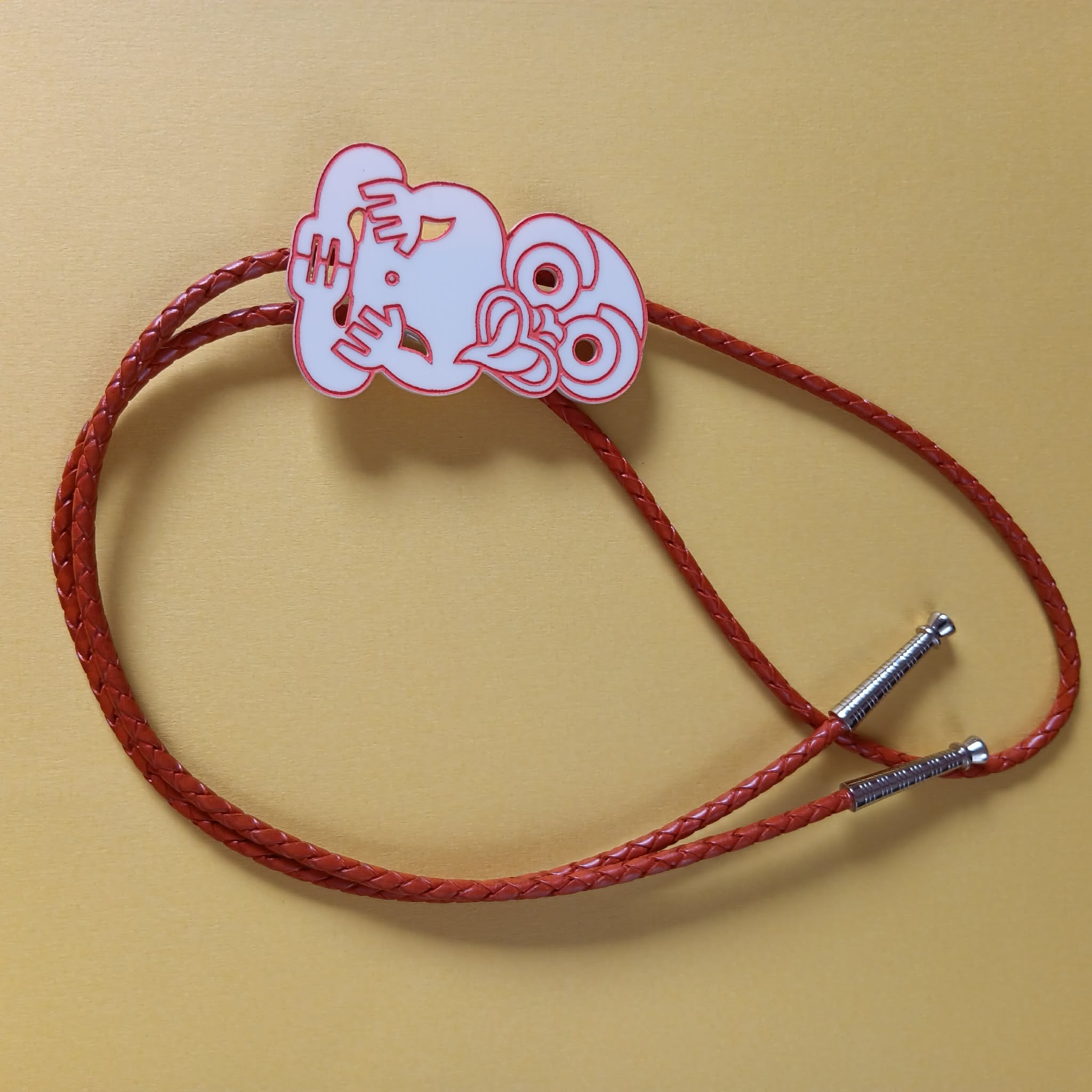 TIKI BOLO TIE - ORANGE LEATHER CORD
